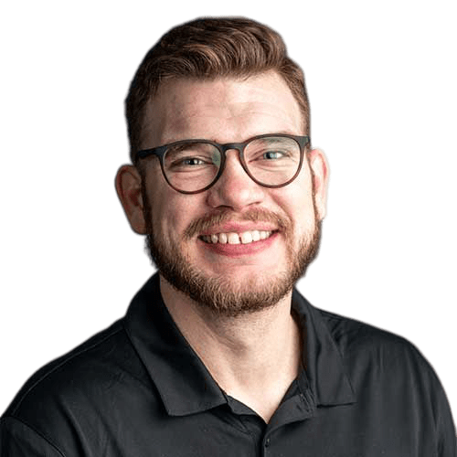 An IT expert with glasses smiling in a black shirt.