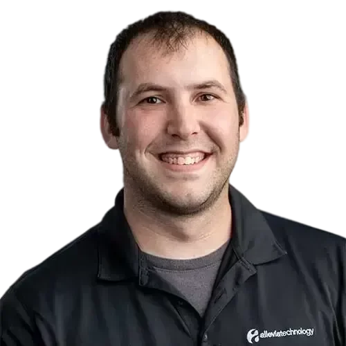 Jonathan W-transformed A man smiling in a black shirt, representing IT expertise.