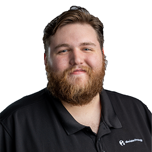 An IT expert with a beard wearing a black polo shirt.