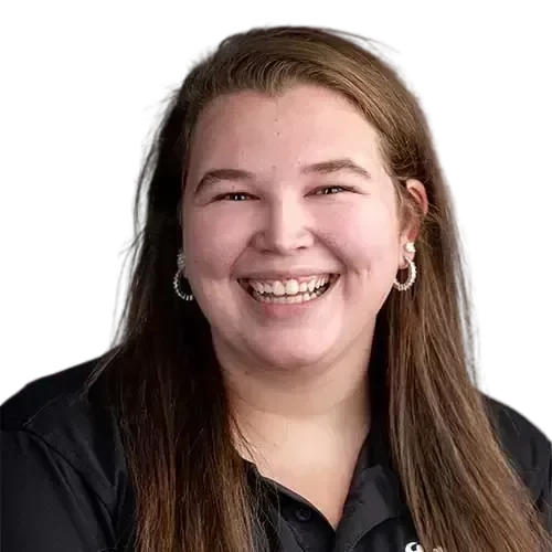 A smiling woman in a black shirt, working as an IT expert managing and maintaining your network and IT investments.