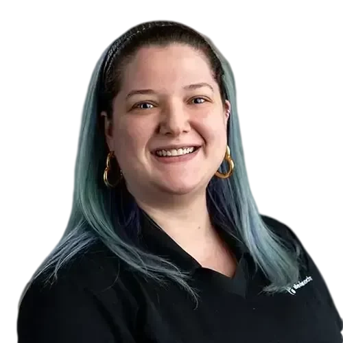 A woman with blue hair and IT expertise manages and maintains your network and IT investments.