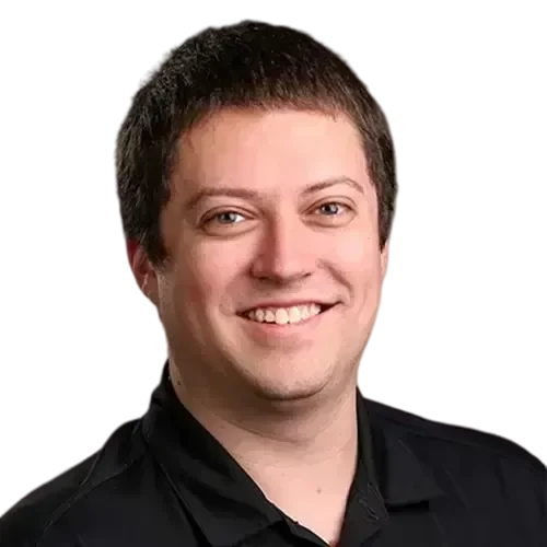 Stefan_web-transformed An IT expert smiling in a black shirt, managing and maintaining your network and IT investments.