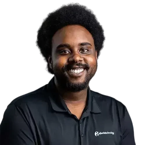 Terrance-32822-1-transformed A black IT expert smiling in a black polo shirt.