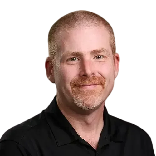 archer_web-transformed A bearded IT expert in a black shirt managing and maintaining your network and IT investments.