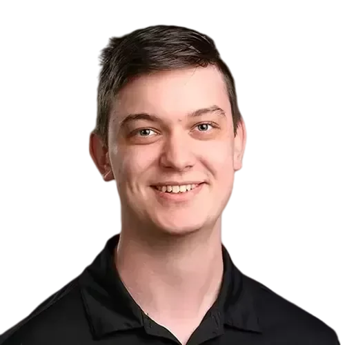 An IT expert wearing a black shirt smiling for the camera.